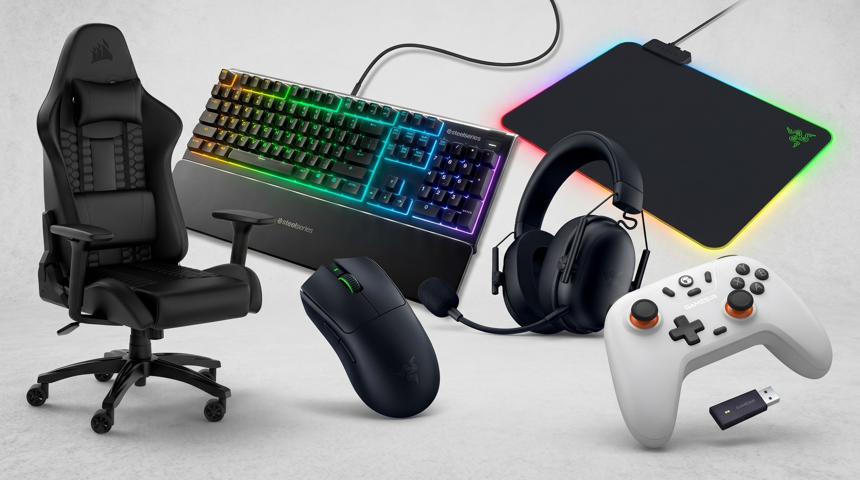 A gaming chair, gaming mouse, gaming keyboard, headset, mouse pad and game controller on a grey background