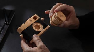 This wooden Leica M toy camera brings back the charm of photography with the signature red dot and lettering