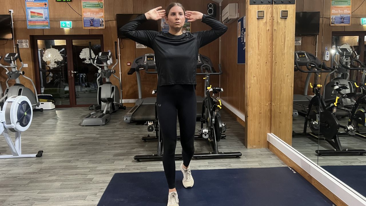 Fitness writer Daniella Gray doing a walking workout in a gym setting