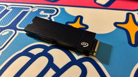 The Seagate Game Drive M.2 SSD placed on a colorful desk mat.