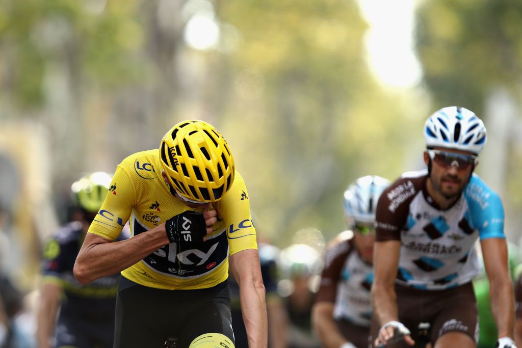 Chris Froome crosses the line and calls ahead his dinner order