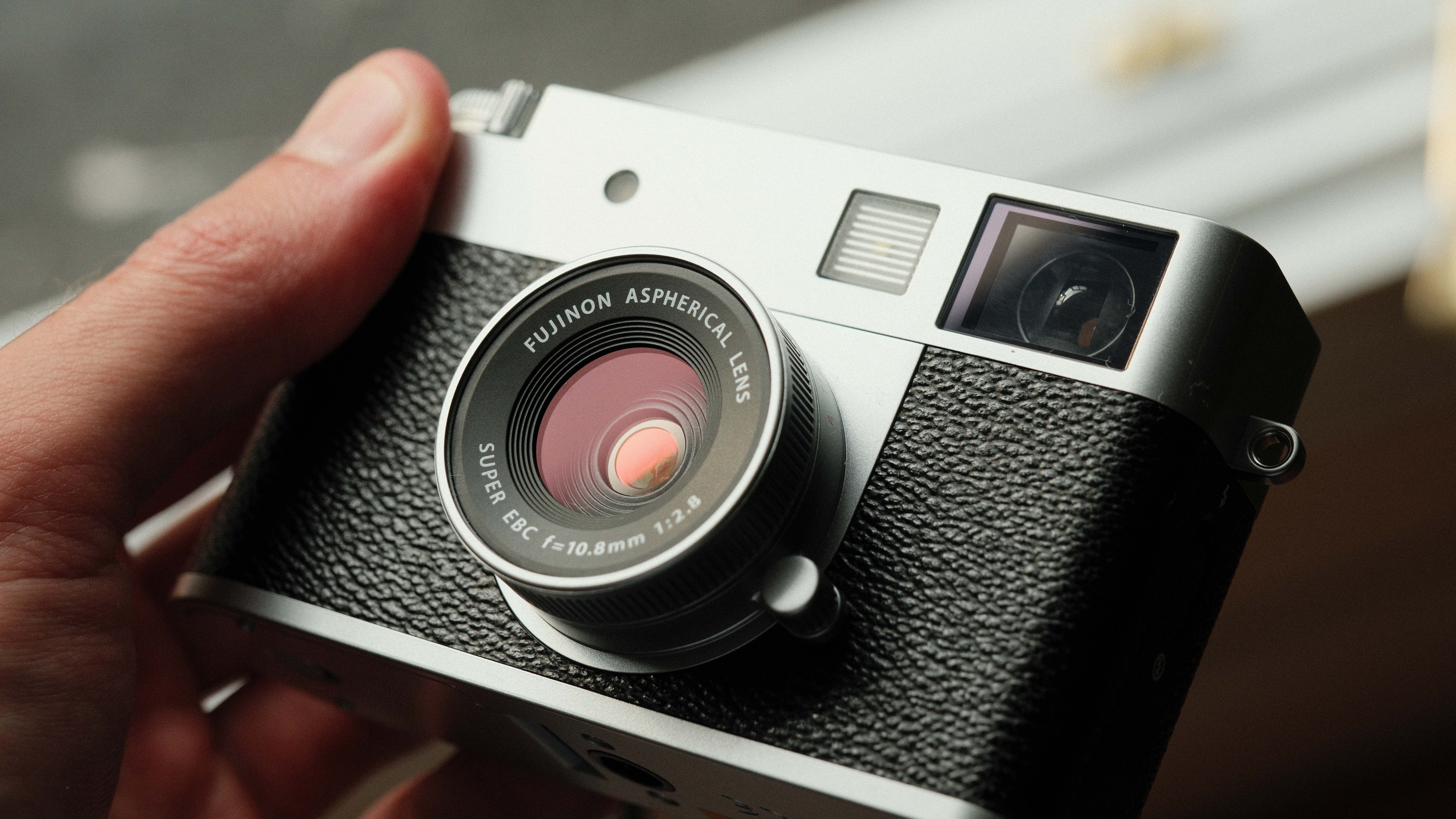 Fujifilm X Half camera held in a hand