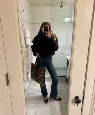 Sara Walker in Khaite Jeans and a leopard Alaia Bag