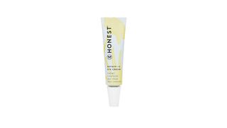 Honest Beauty Depuff + C Eye Cream in a yellow and white aluminum squeeze tube for the best drugstore eye creams.