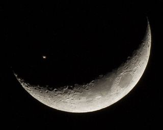 International Space Station Transits Moon by Juan Gonzalez-Alicea 