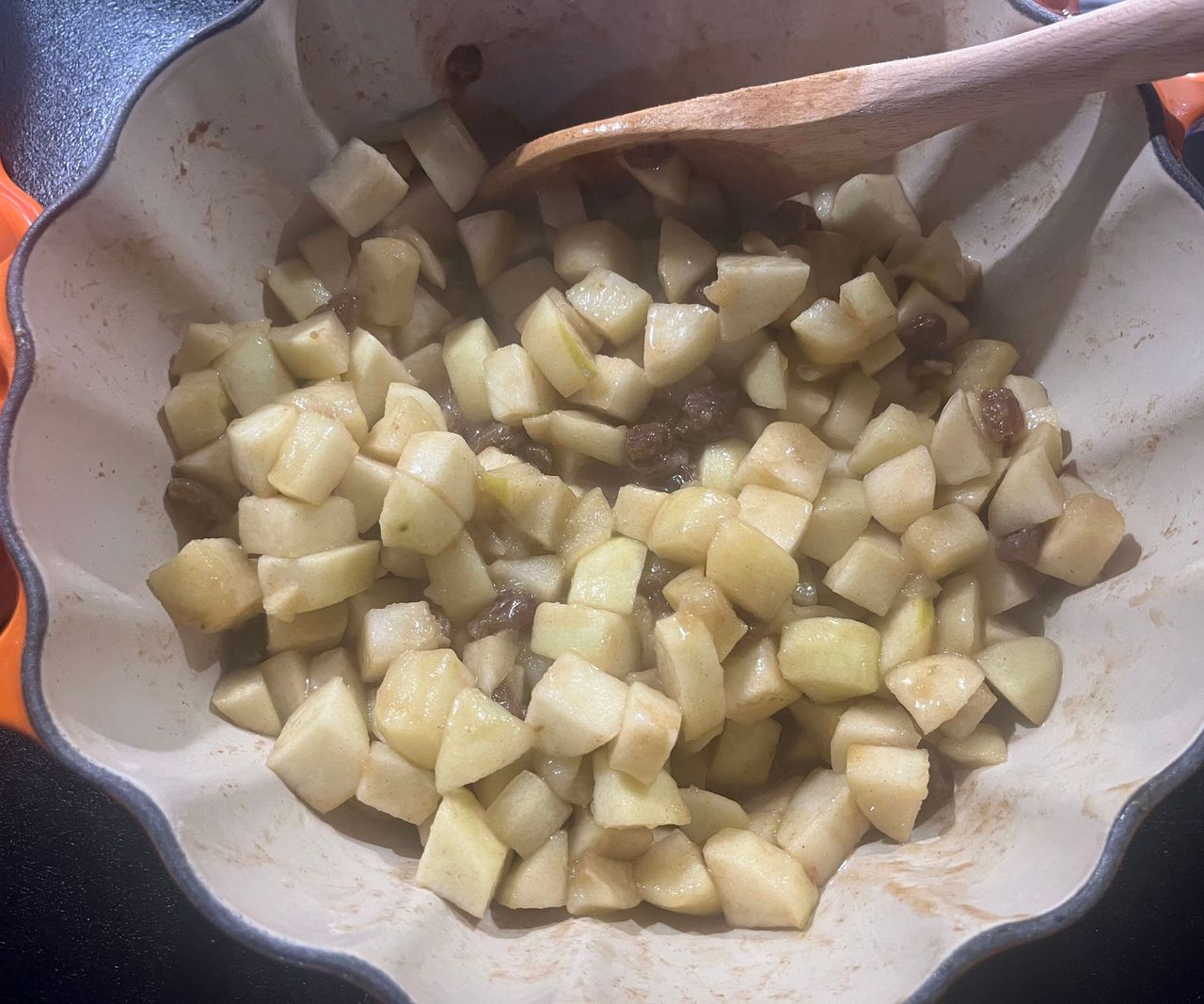 A pumpkin Dutch oven with stewed apple and sultanas inside.
