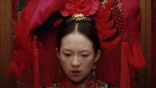 Zhang Ziyi as Jen Yu in a red dress during Crouching Tiger, Hidden Dragon, one of the best movies on HBO Max.