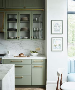 Neutral kitchen with sage green cabinets