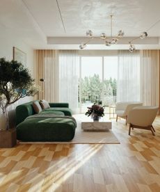 Modern living room with vinyl floor, green sofa, two armchairs, rug and marble coffee table in front of wall-to-wall windows and sliding walls.