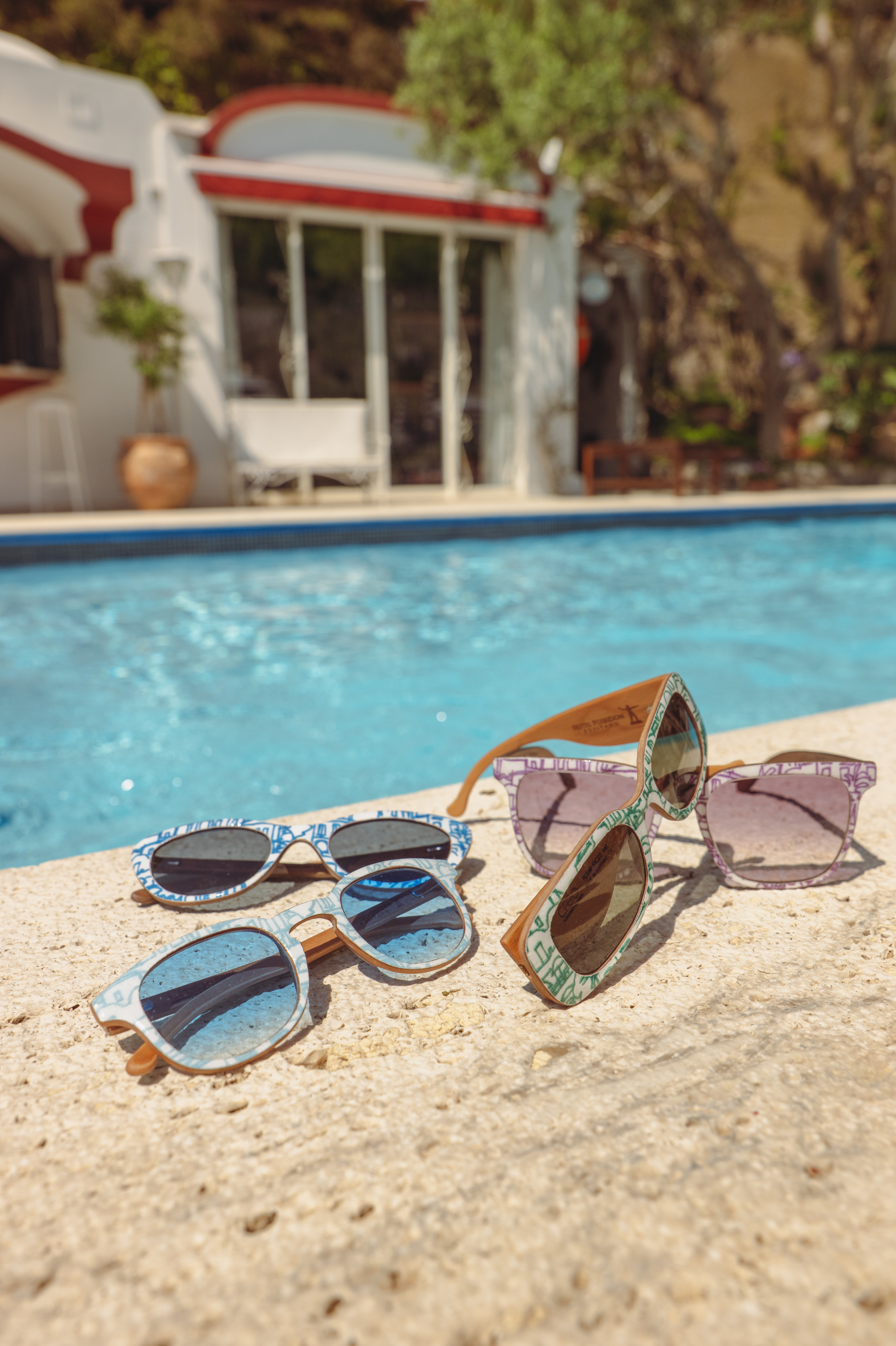 CREO Positano sunglasses in front of the pool at Hotel Poseidon Positano