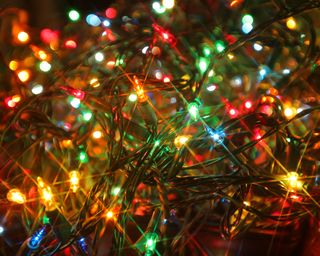 A close-up of multi-coloured Christmas lights