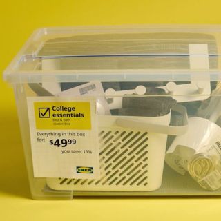 A see-through plastic box of college dorm essentials from IKEA