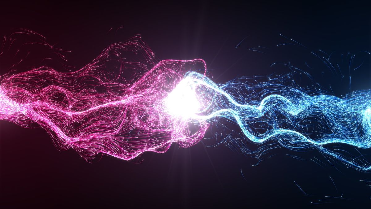 Abstract image of two waves of light (one pink the other red) colliding together.