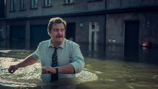 Tomasz Schuchardt as Jakub Marczak wading through water
