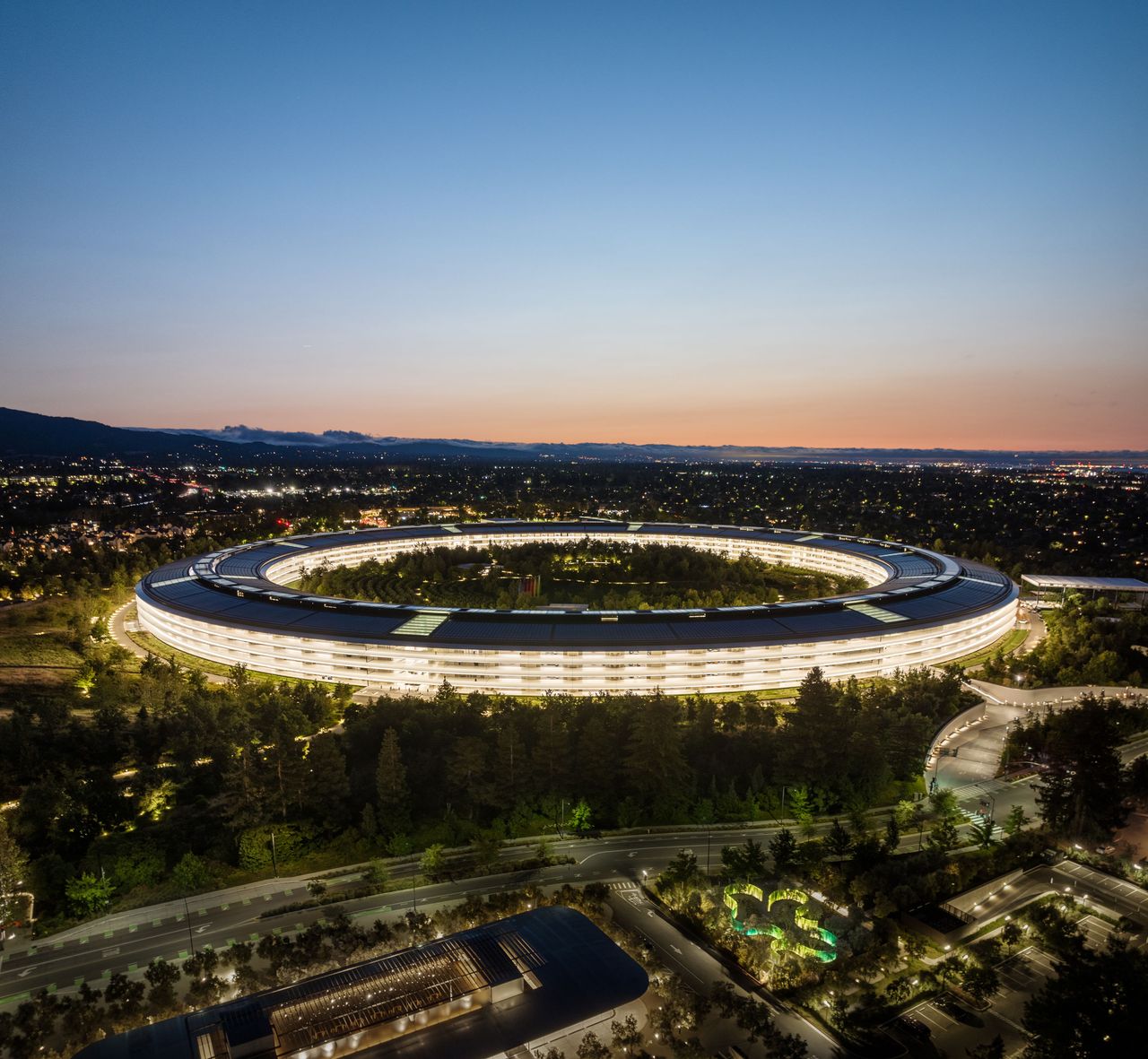 Apple Park at night; the company never even publicly acknowledged the project for an Apple Car