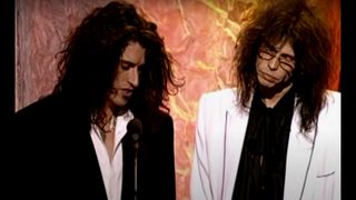 Joe Perry (left) and Steven Tyler induct Led Zeppelin into the Rock & Roll Hall of Fame in 1995