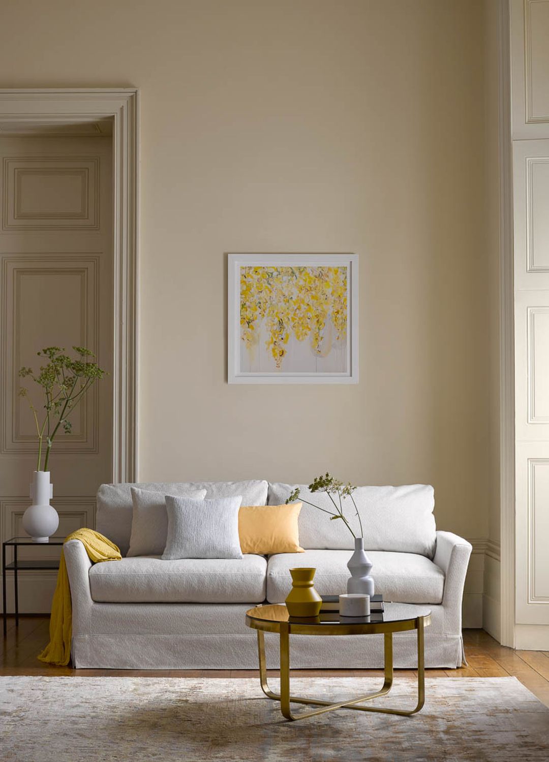 picture of living room with butter yellow walls and furnishings