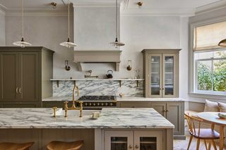 a kitchen with arabascato countertops