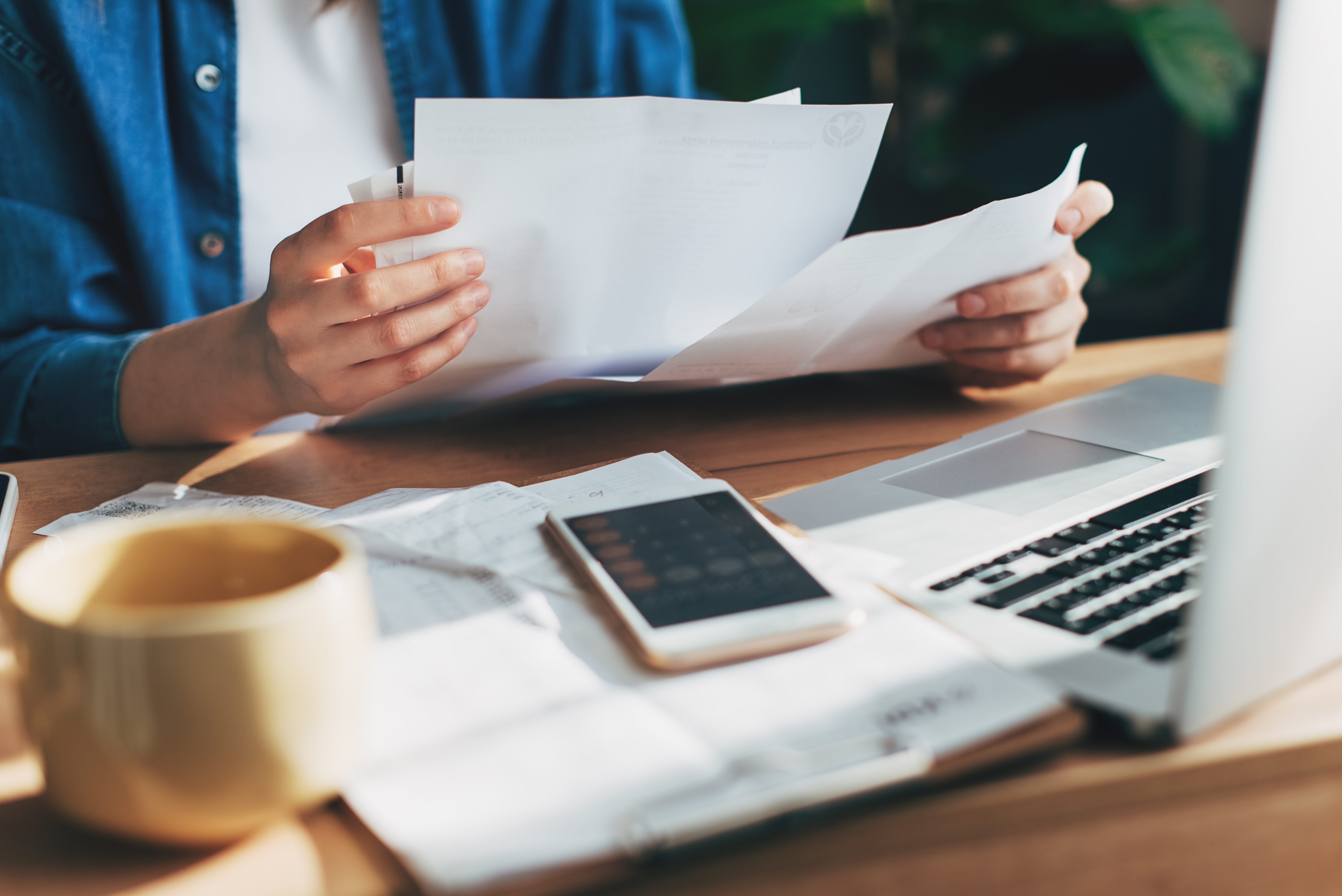 Woman accountant looking at financial paperwork