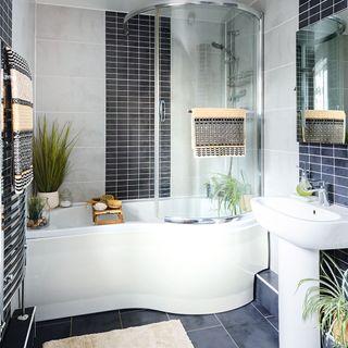 bathroom with curved bath and shower