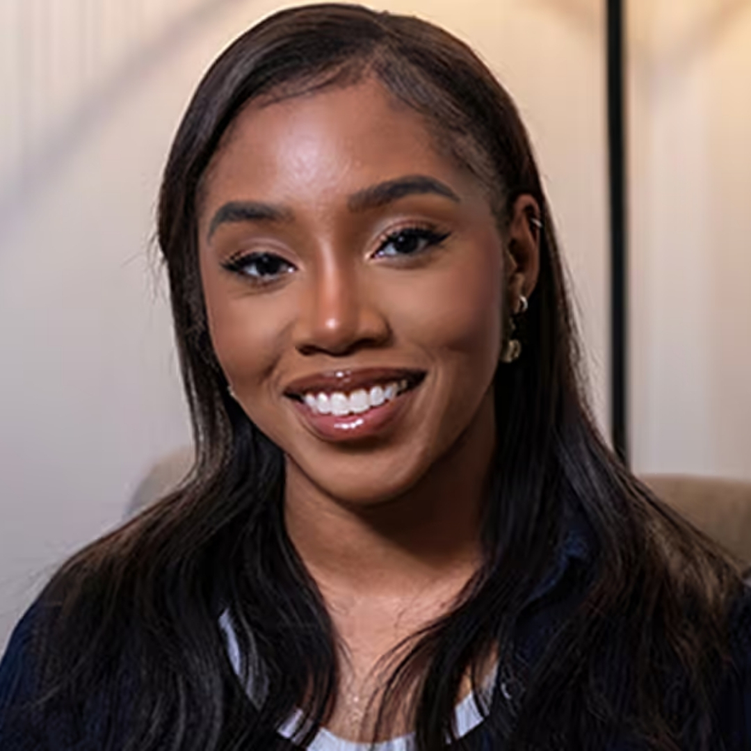 Image of Teresa O'Nwere-Tan smiling with long straight brunette hair