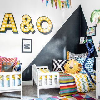 kids twins room with pillows on two bed