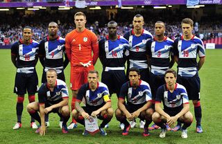 Britain&#039;s players (top from L) midfielder Scott Sinclair, forward Daniel Sturridge, goalkeeper Jack Butland, defenders Micah Richards, Steven Caulker and Ryan Bertrand and midfielder Aaron Ramsey, (bottom from L) midfielder Tom Cleverley, forward Craig Bellamy, defender Neil Taylor and midfielder Joe Allen pose for a team photo before the London 2012 Olympic Games men&#039;s football match between Britain and Uruguay at the Millennium Stadium in Cardiff, Wales, on August 1, 2012. AFP PHOTO / GLYN KIRK (Photo credit should read GLYN KIRK/AFP/GettyImages)