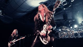 Chris Caffery (L) and Joel Hoekstra of Trans-Siberian Orchestra perform onstage during an exclusive performance at The iHeartRadio Theater in New York at iHeartRadio Theater on November 17, 2014 in New York City.