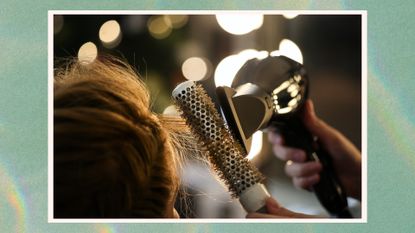 Image of hairstylist blowdrying hair with a round brush and hair dryer, on a green watercolour background