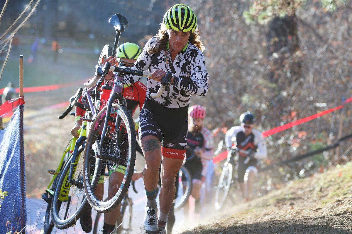 Clark carries his custom Squid Bikes up the run-up, leading the chase
