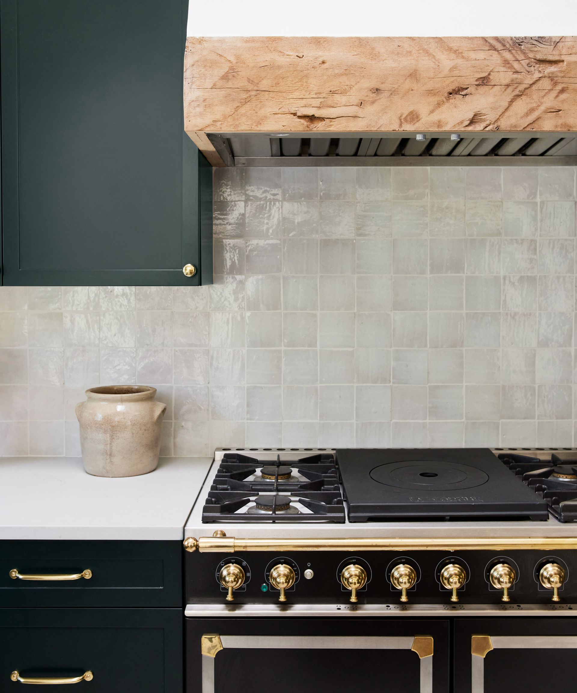 A backsplash idea for kitchens with white zellige tiles and green cabinets