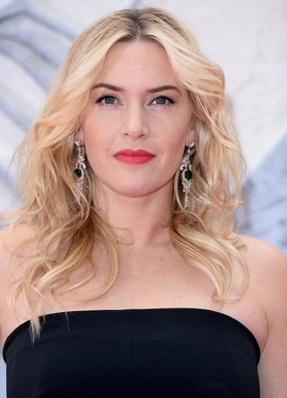 Kate Winslet with subtly metallic eyes and bold lips