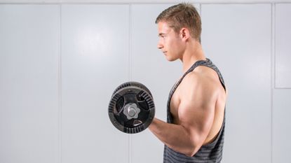 Man performing a biceps curl with dumbbells