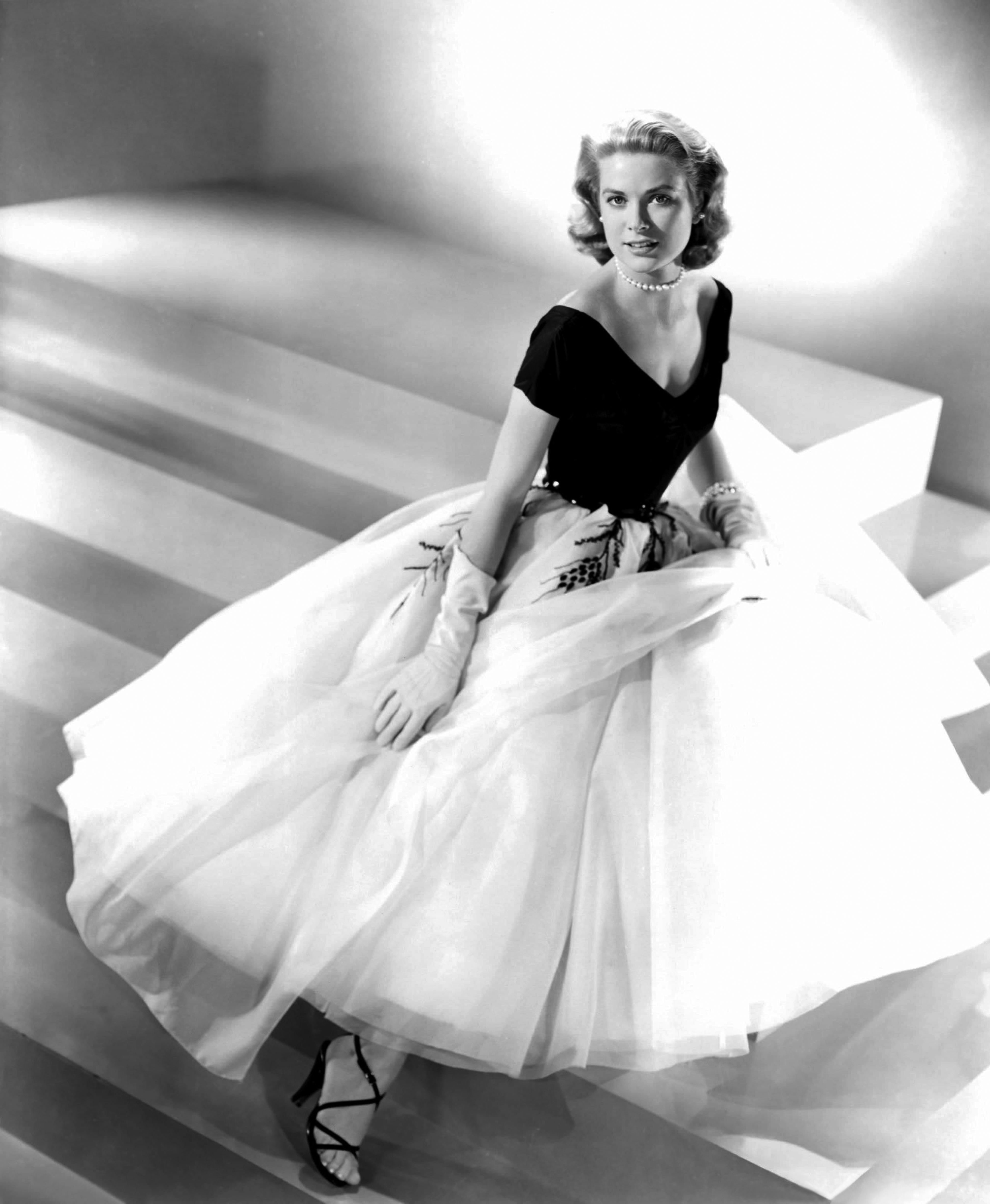 Grace Kelly wearing a black and white gown in Rear Window