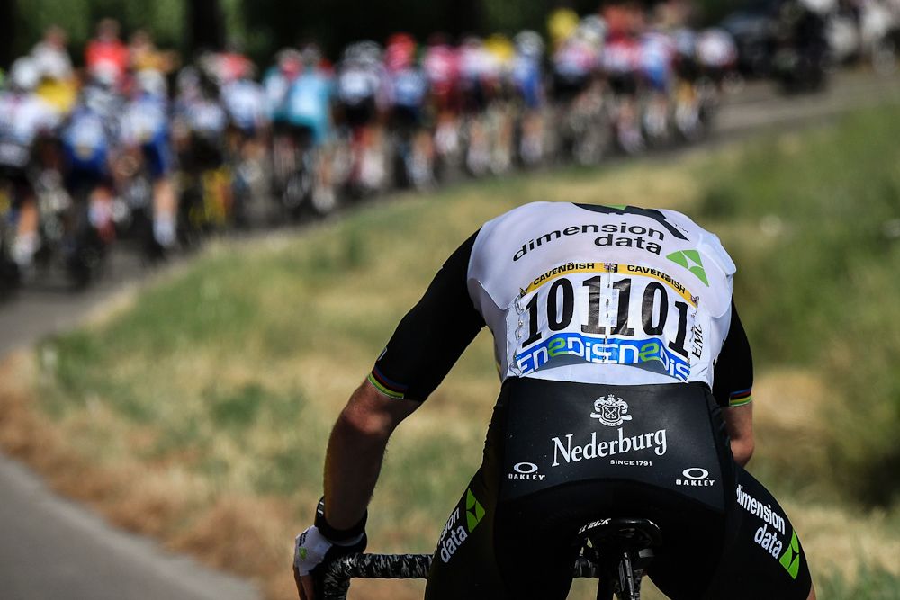Mark Cavendish checks his bike near the end of stage 11 at the Tour de France
