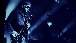 Duncan Kilburn, former Psychedelic Furs member, plays sax onstage for the Sisters of Mercy 