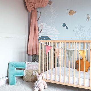girls bedroom with cot and wall mural