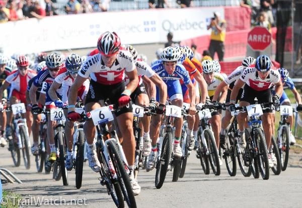 The Under 23 men are led out by Thomas Litscher (Switzerland)