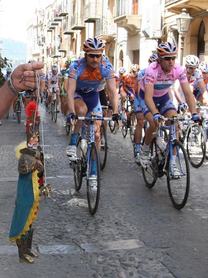 A mustachioed David Zabriskie rides along side teammate a maglia rosa-clad Christian Vande Velde at the 2008 Giro d'Italia