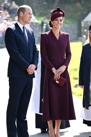 Catherine, Princess of Wales - who carries a burgundy clutch bag - and Prince William, Prince of Wales visit St Davids Cathedral for a service to commemorate the first anniversary of the death of Queen Elizabeth II, on September 08, 2023 in St Davids, United Kingdom.