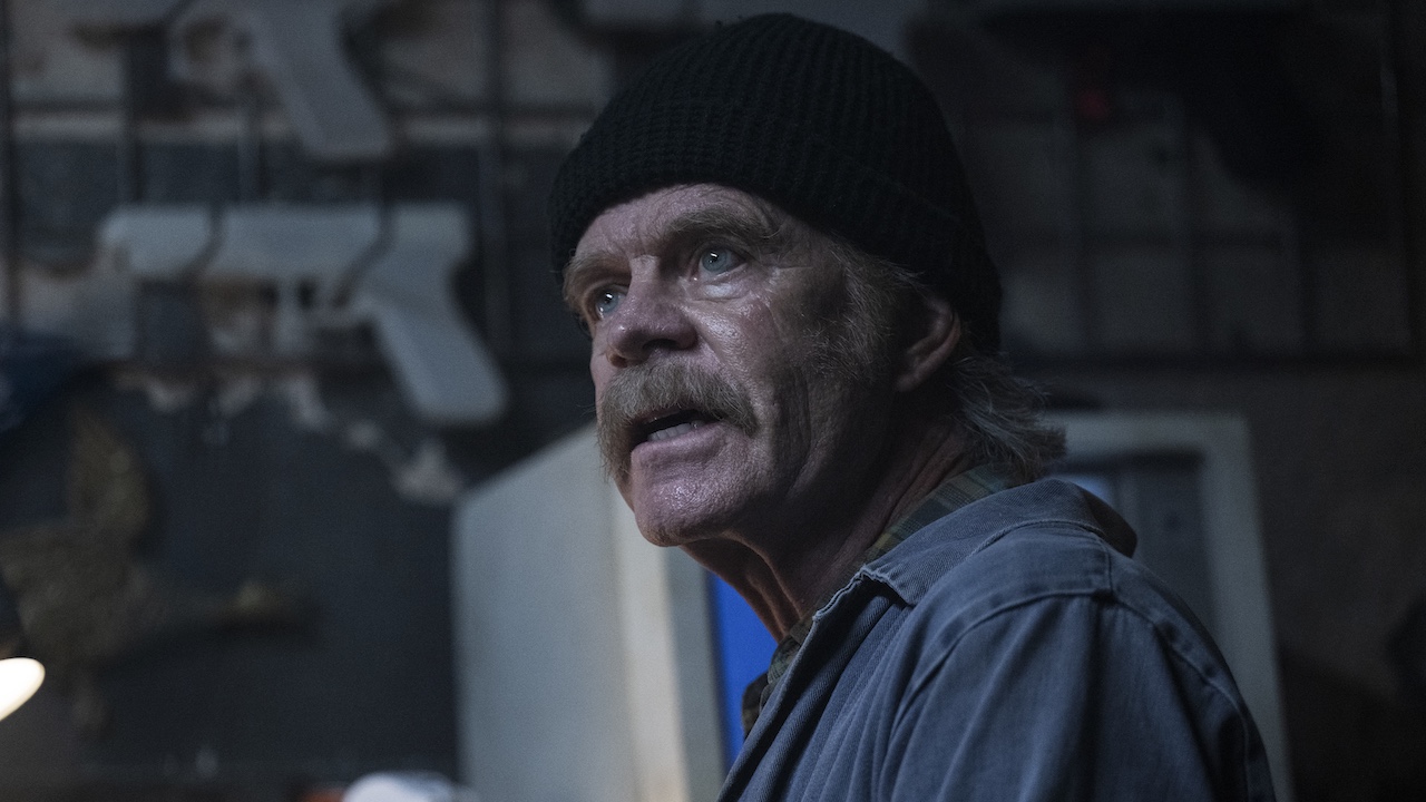 William H. Macy as Molie in The Running Man