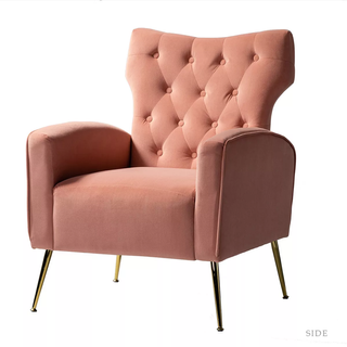 Pink tufted accent chair.