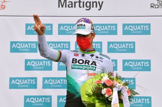 MARTIGNY SWITZERLAND APRIL 28 Peter Sagan of Slovakia and Team Bora Hansgrohe stage winner celebrates at podium during the 74th Tour De Romandie 2021 Stage 1 a 1681km stage from Aigle to Martigny Mask Covid safety measures Flowers TDR2021 TDRnonstop UCIworldtour on April 28 2021 in Martigny Switzerland Photo by Luc ClaessenGetty Images