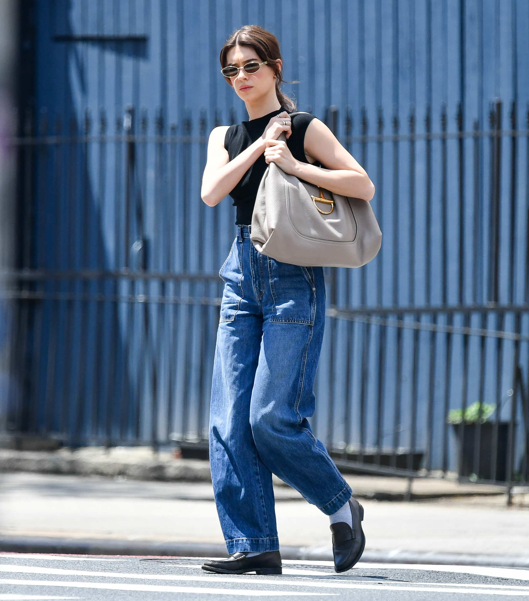 Daisy Edgar-Jones carrying a Gucci bag with a black tank top in New York.