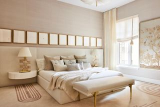 The master bedroom in a Manhattan apartment features a calming colour scheme, while pieces include a new rug design by Kelly Behun for The Rug Company and a hand-painted panel by Gracie Studio