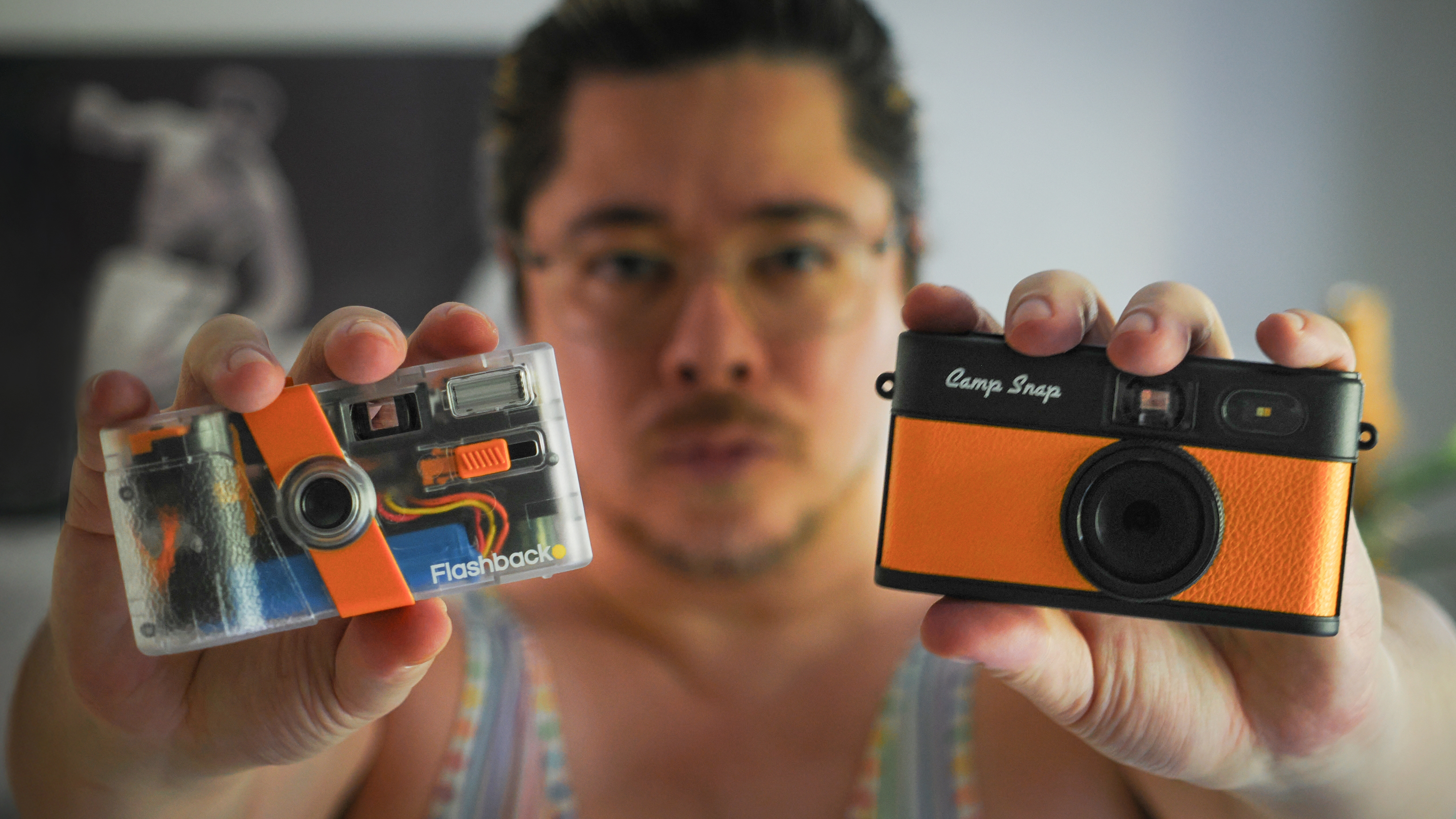 James Artaius holding up a Flashback One35 V2 and a Camp Snap 2