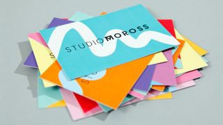 These multicoloured business cards suggest, rather than reproduce, Moross's characteristic lettering designs