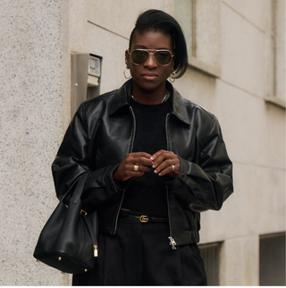 Nikki Ogunnaike wearing a leather jacket, a black tee, and black pants