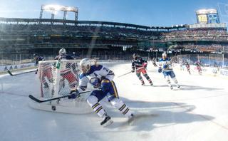 Buffalo Sabres right wing Kyle Okposo (21) plays behind New York Rangers goaltender Henrik Lundqvist (30) during the 2018 Winter Classic between The New York Rangers and The Buffalo Sabres at Citi Field in Queens, NY.