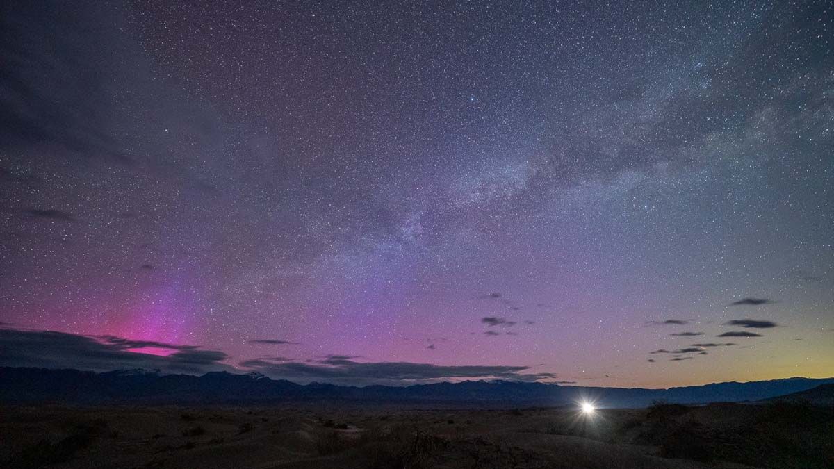 Purple aurora glow seen above the horizon from California&#039;s Death Valley.